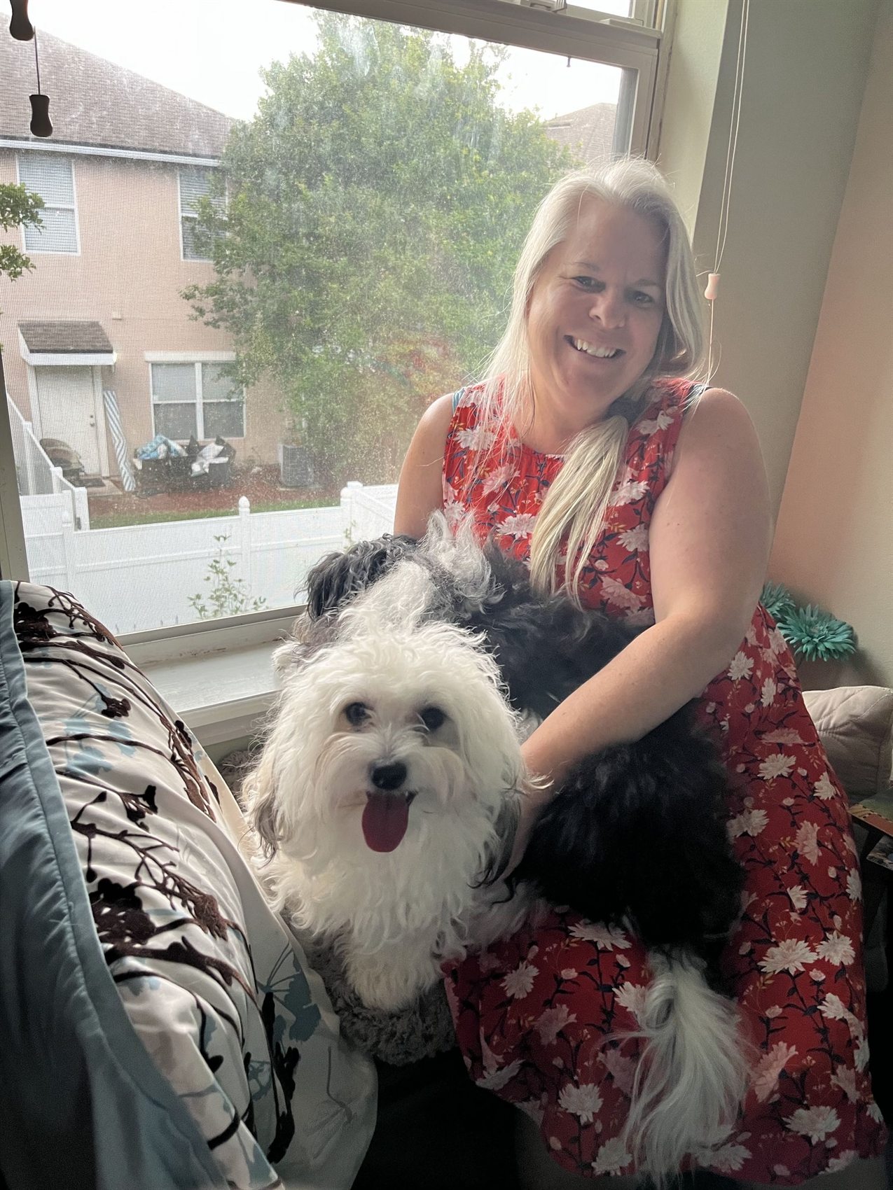 Mom smiling with Auggie and Remi